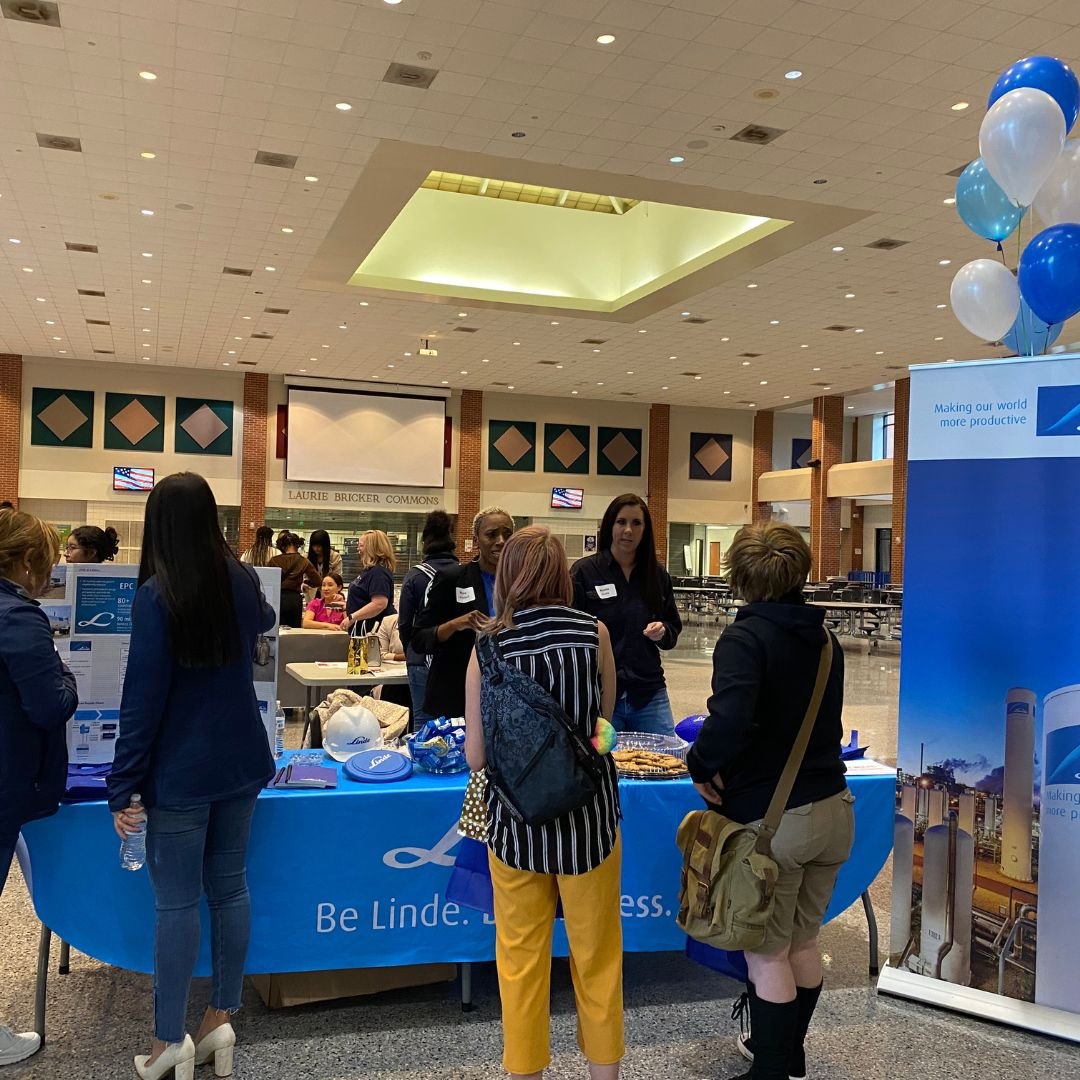 Young women visiting the Linde table at a Nerdy Girl Success career exploration event